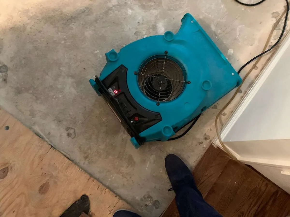 Air mover drying subfloor during Commercial Water Damage Restoration in Amarillo